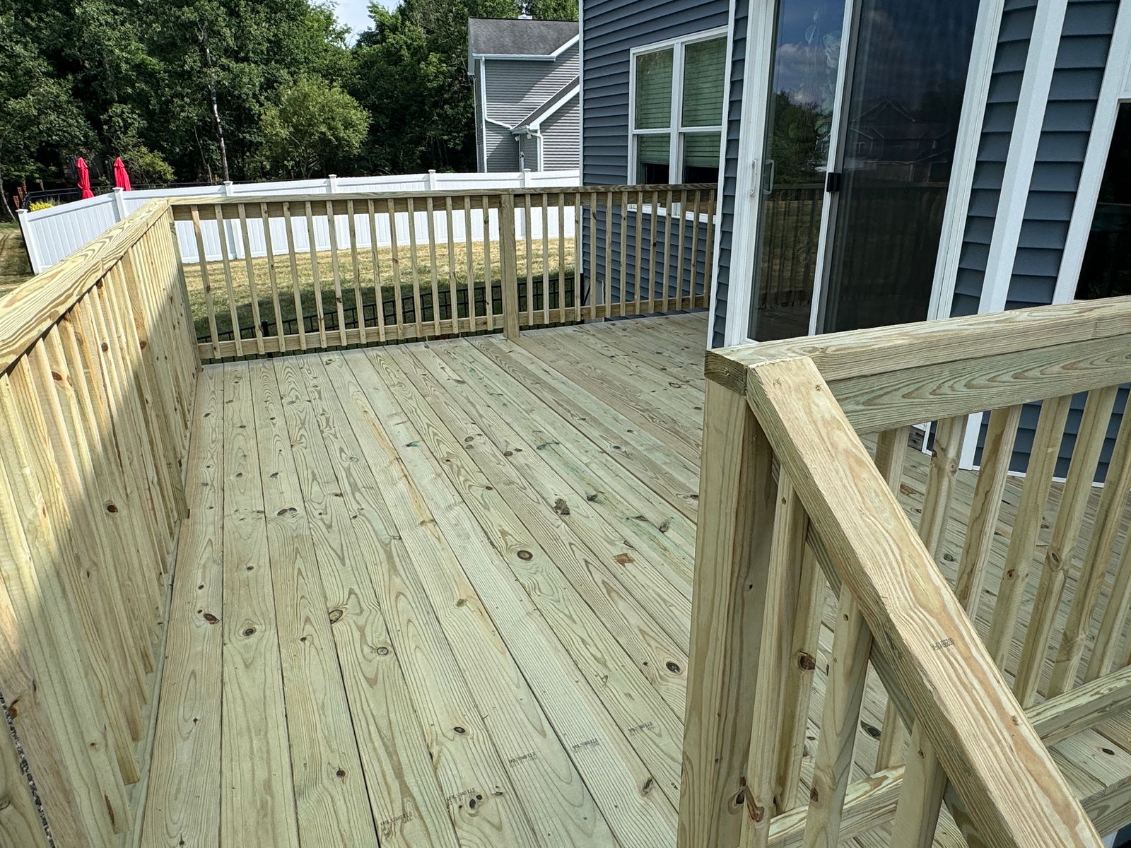 Pressure-treated deck surface and railings