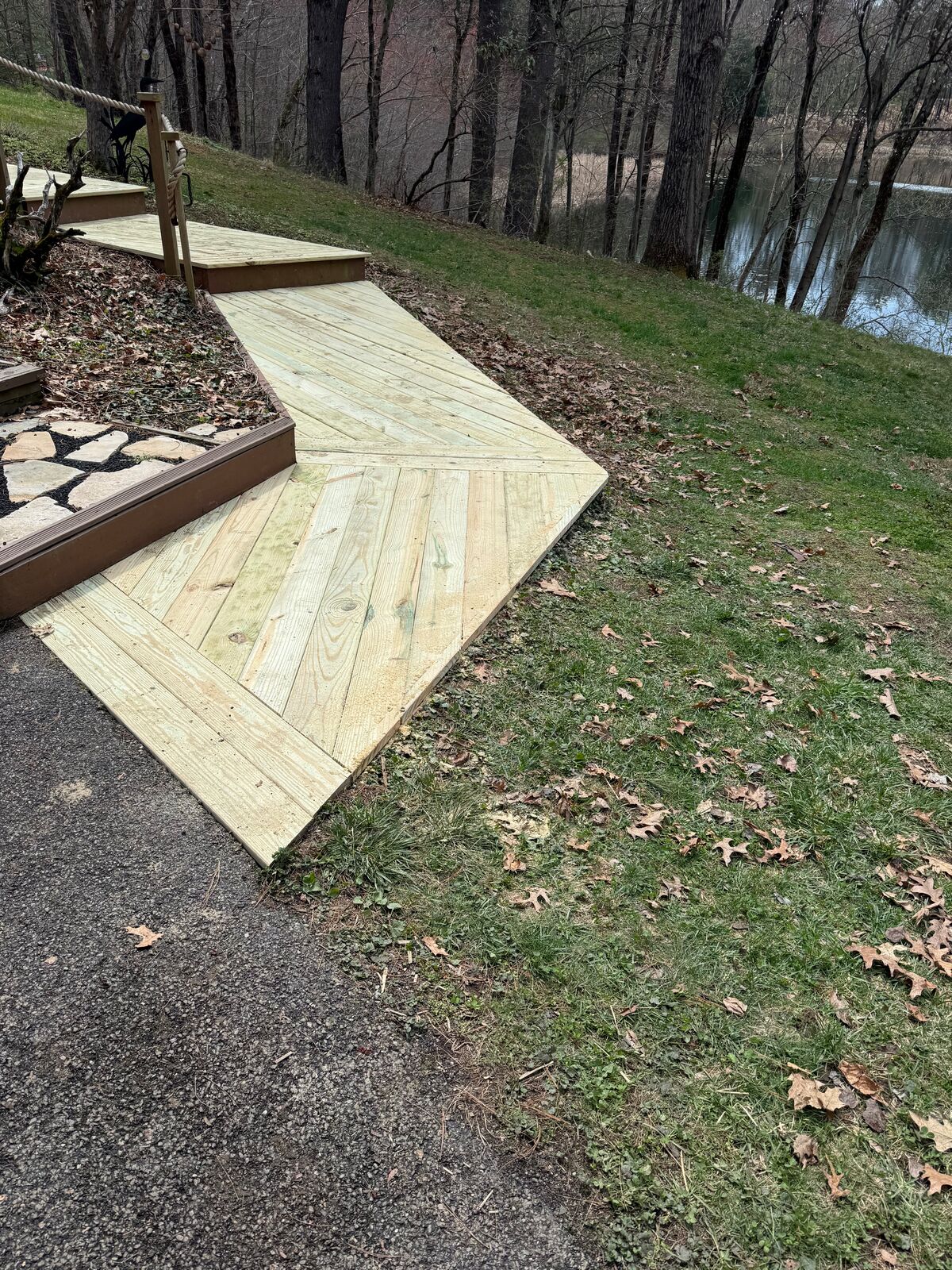 Ground-level pressure-treated walkway with angled boards