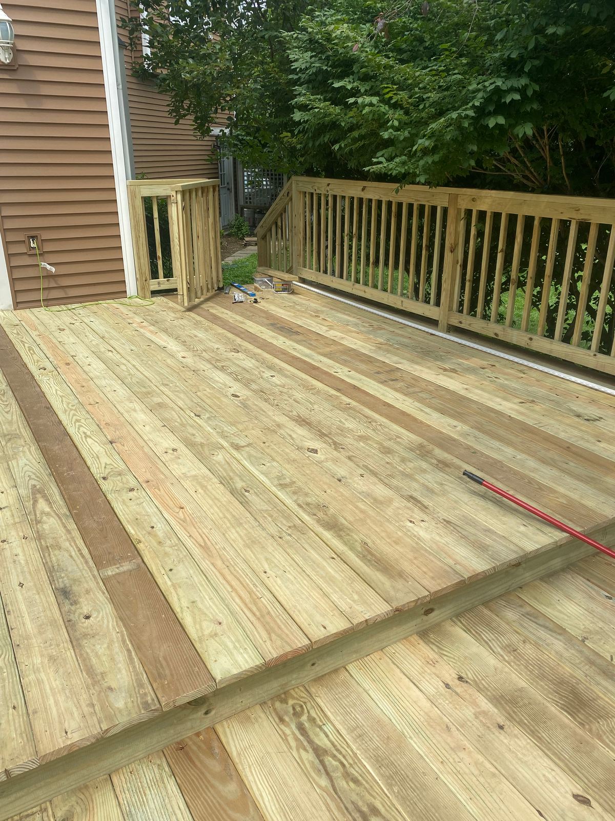 Pressure-treated deck with new railing