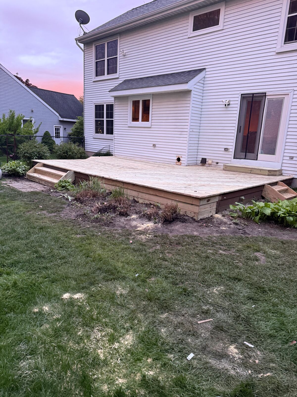 Ground-level deck across the back of a home