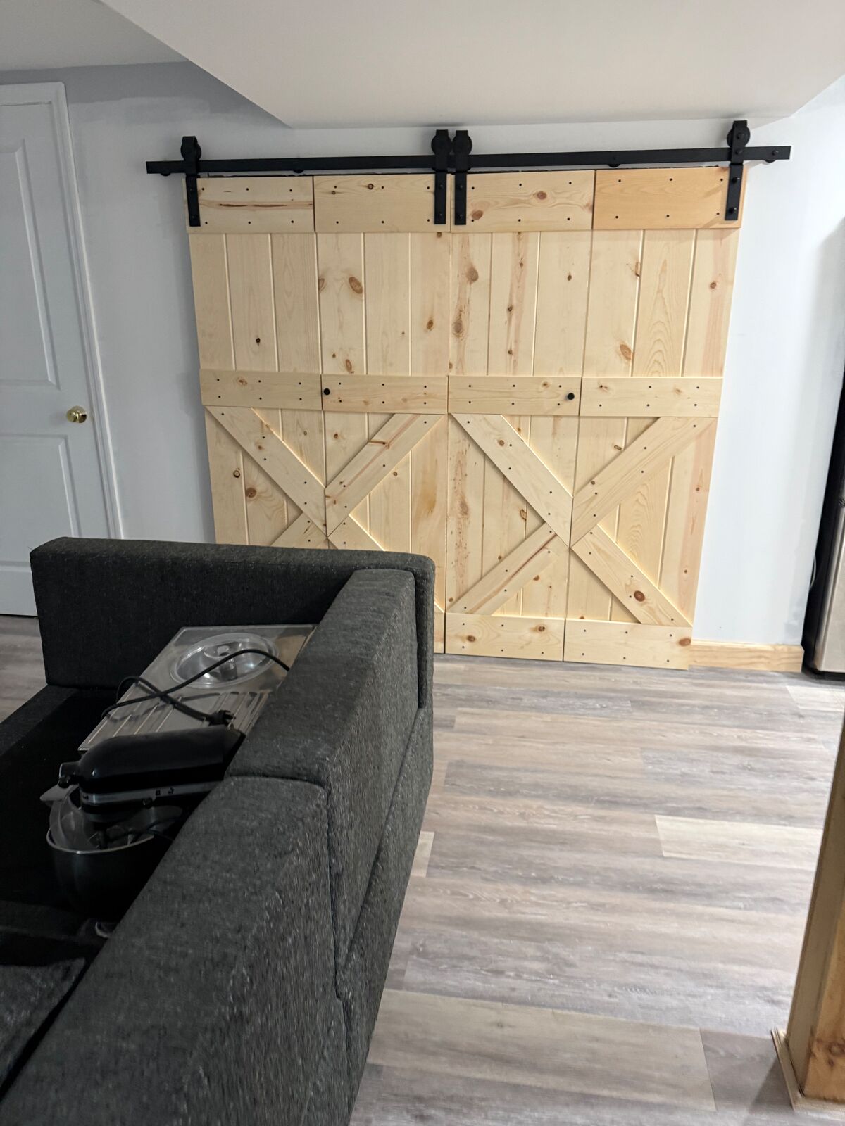 Sliding barn doors on black track hardware