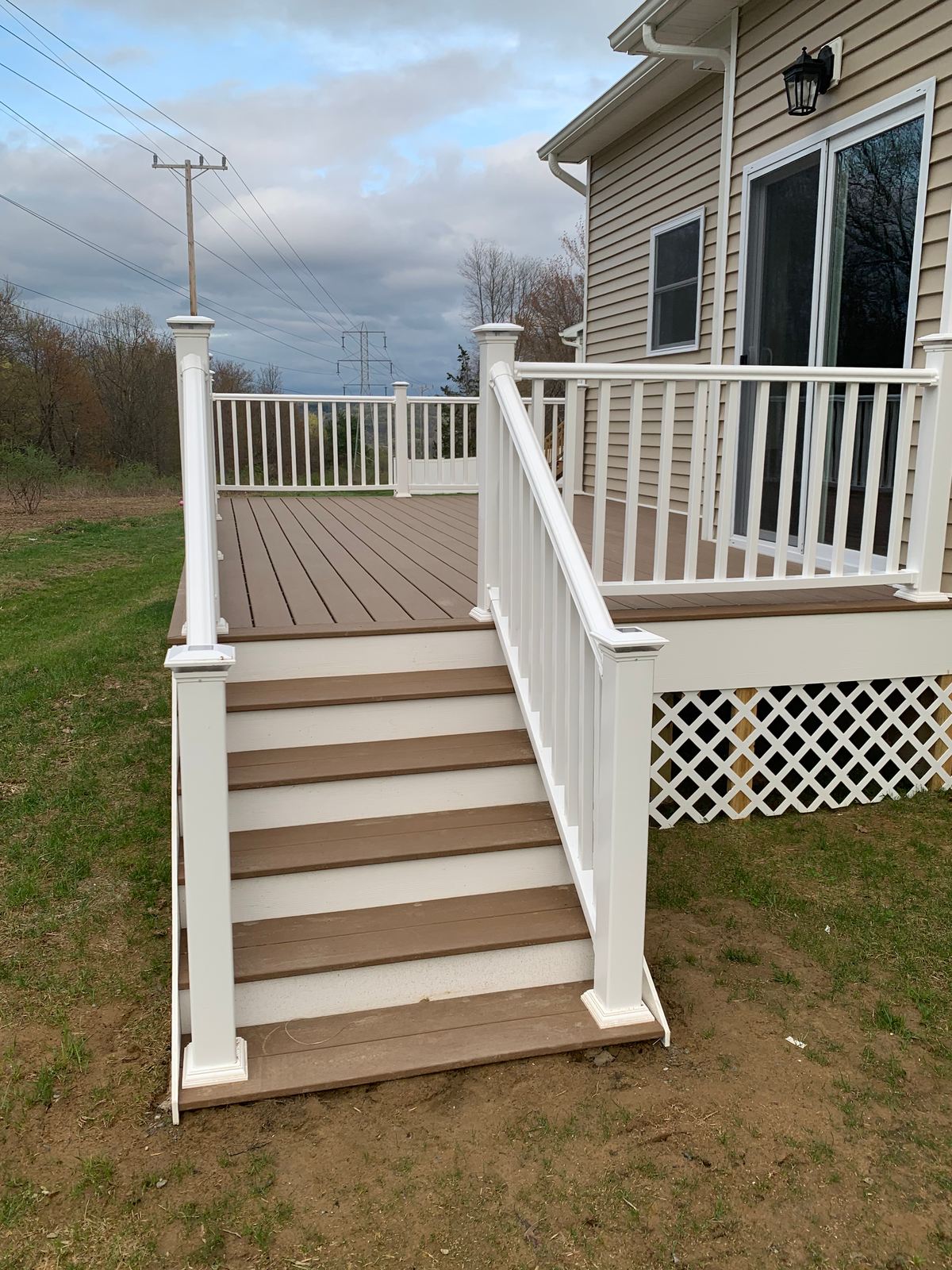 Deck stairs with white railings