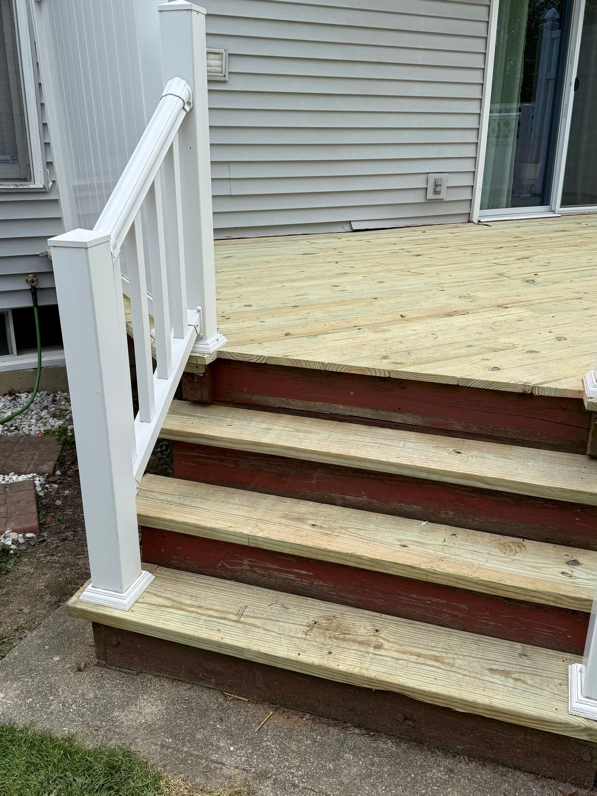 Deck steps and landing resurfaced with pressure-treated boards